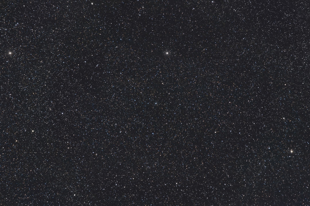 a night sky with a few stars in it