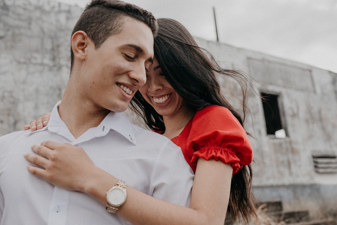 woman in white button up shirt smiling