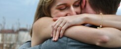 couple reconcile hug