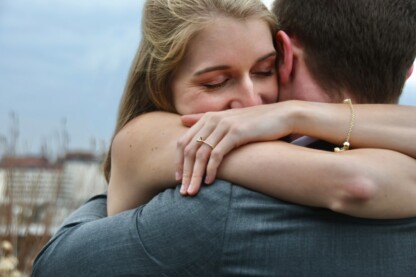 couple reconcile hug